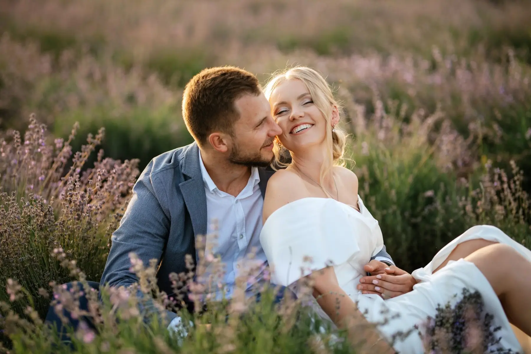 Bride And Groom On In The Lavender Field Sit