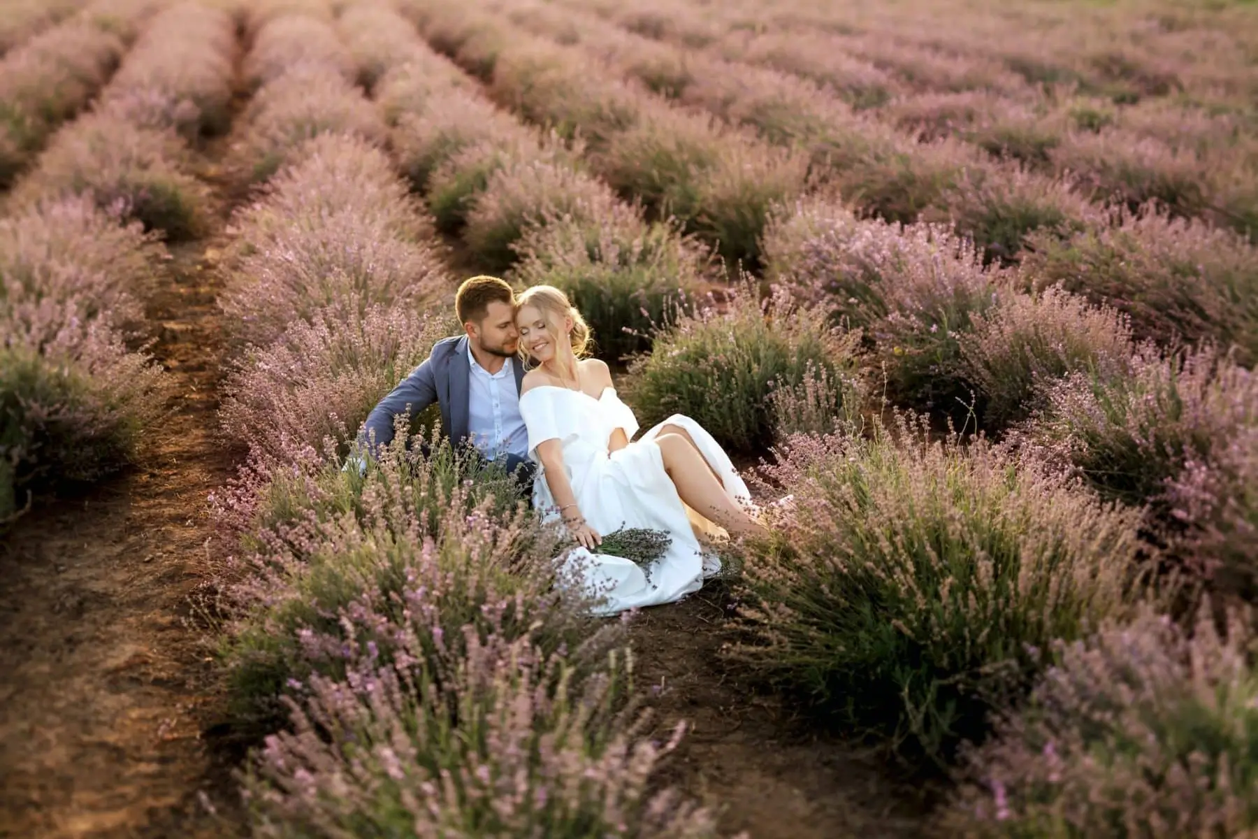 Bride And Groom On In The Lavender Field Smile