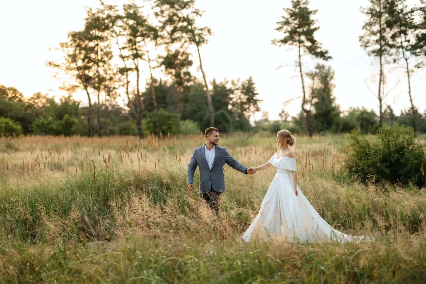 Bride And Groom On In The Woods Grass